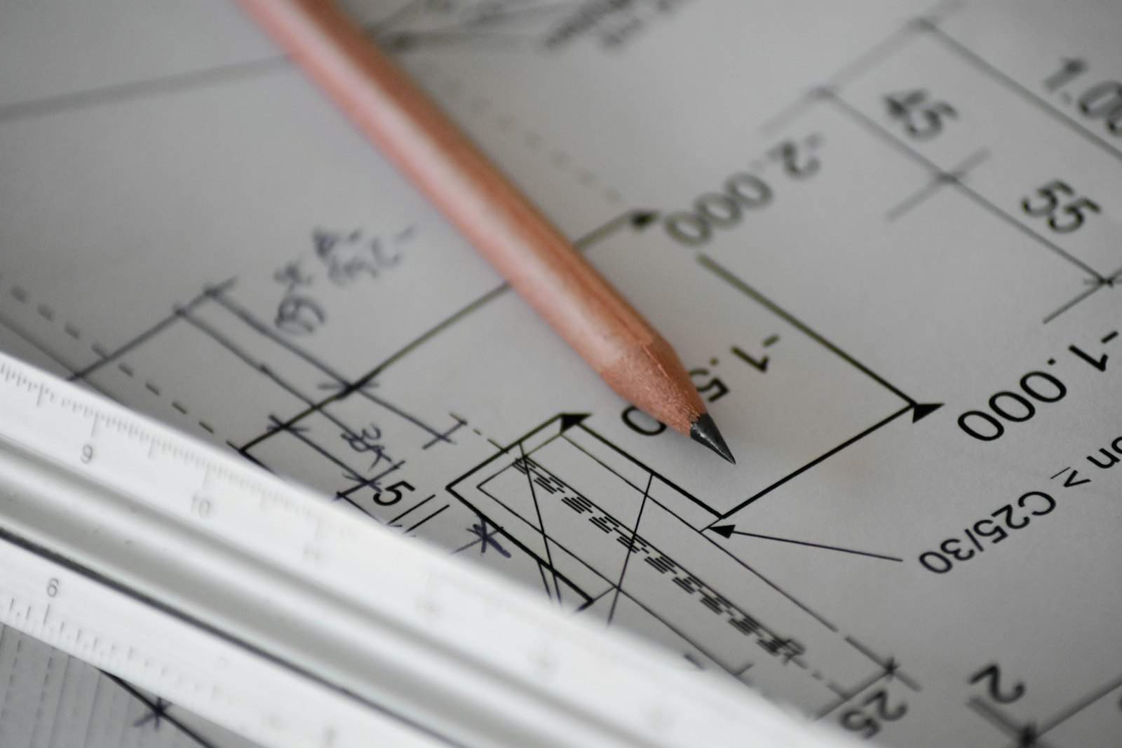 Architect's construction drawings with a pencil