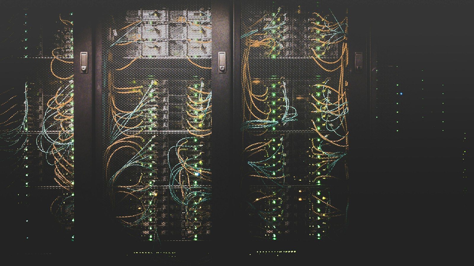 Close up of server racks and network cabling in a data hall